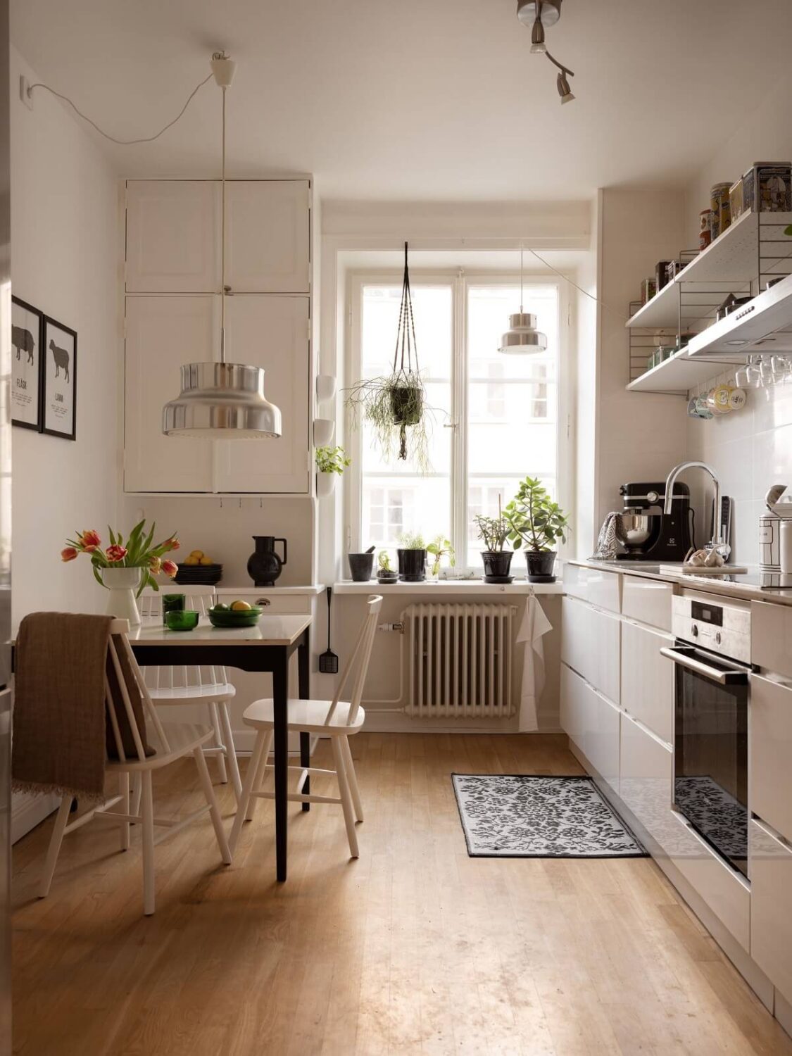 A Swedish Apartment with Light-Filled Rooms 7 small dining table in white kitchen