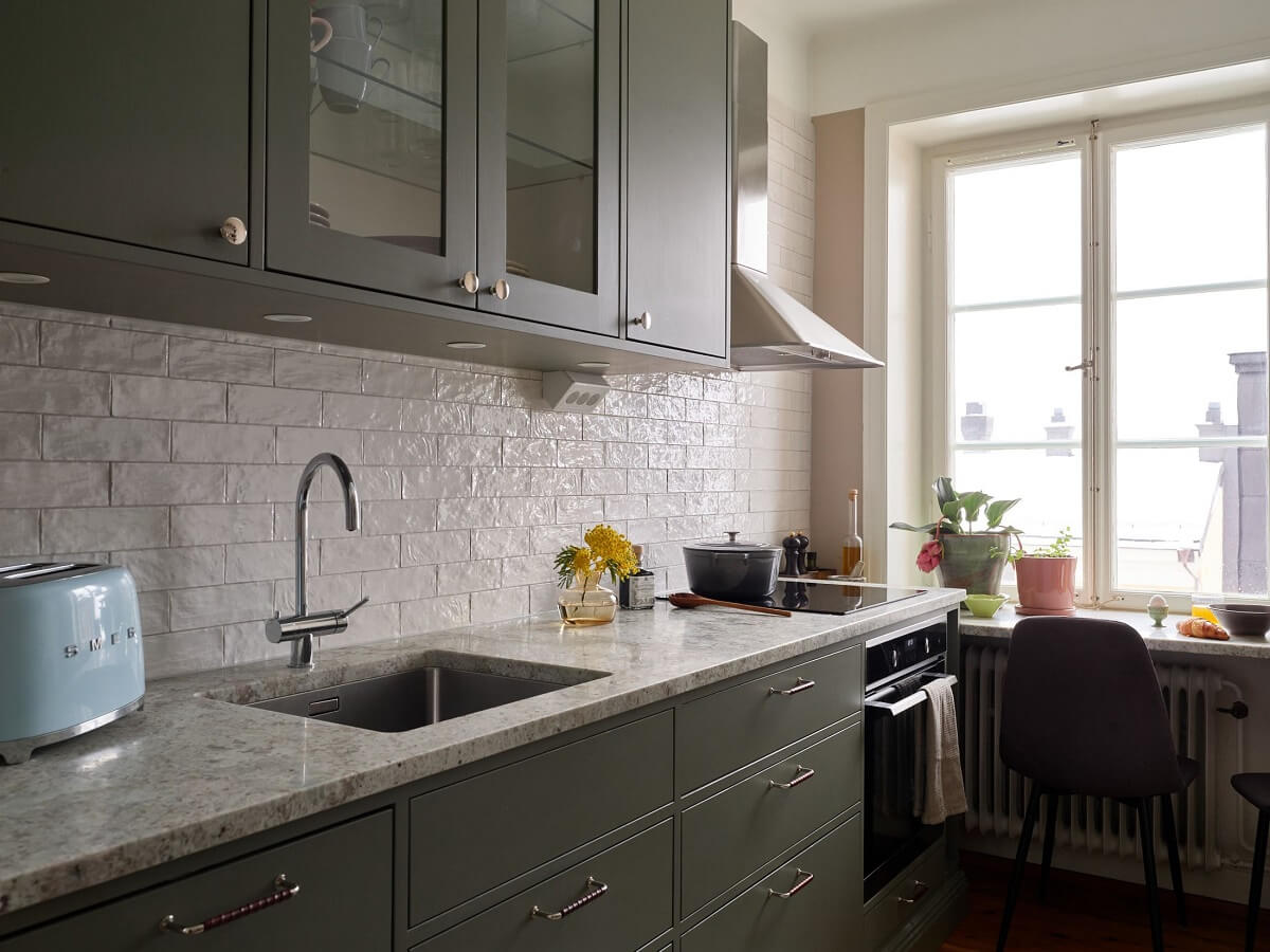 Green Tones in a Renovated Stockholm Duplex Apartment 7 small gray kitchen