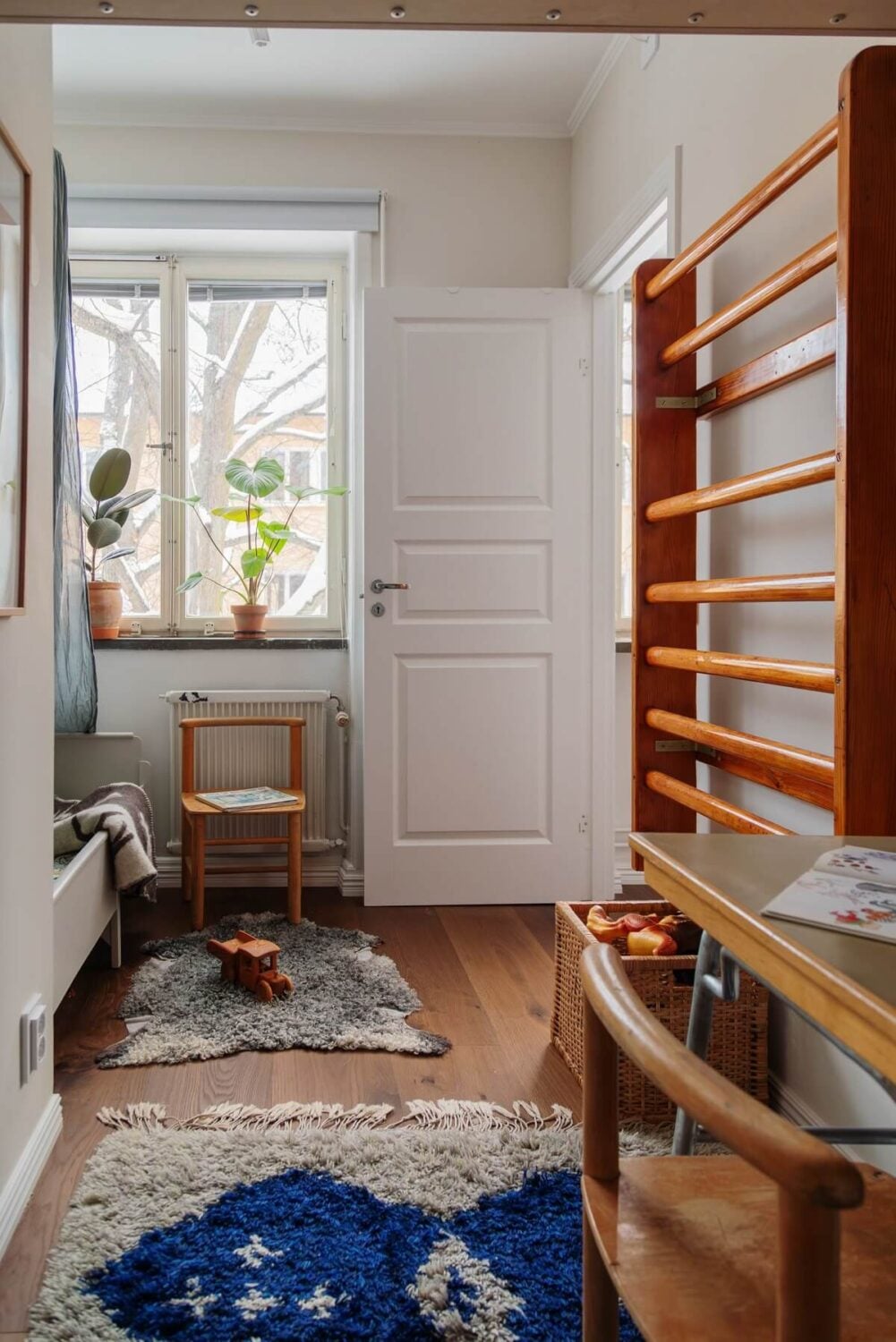 A Small Swedish Apartment with Warm Color Accents 21 small kids bedroom with loft area