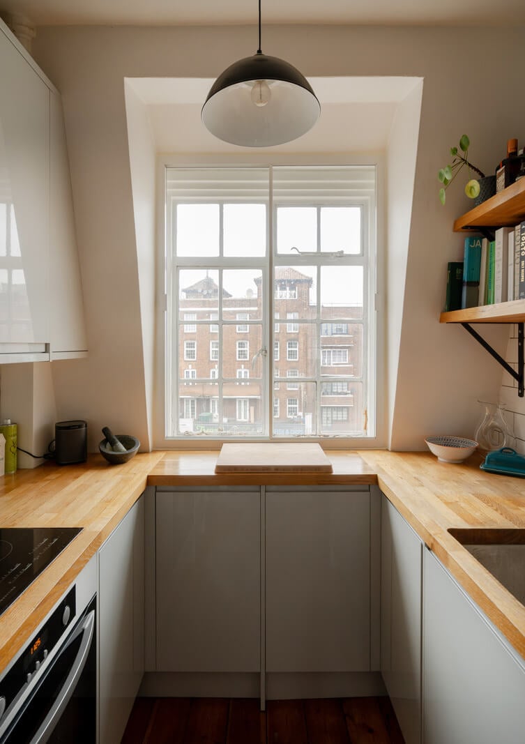 A Charming Top-Floor Apartment in an Art Deco Building 8 small kitchen with dormer window and wooden worktop nordroom