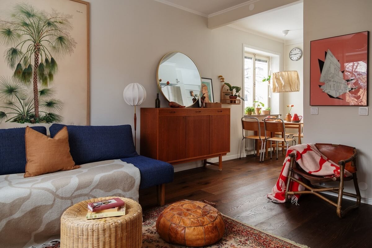 A Small Swedish Apartment with Warm Color Accents 7 small living room with blue sofa