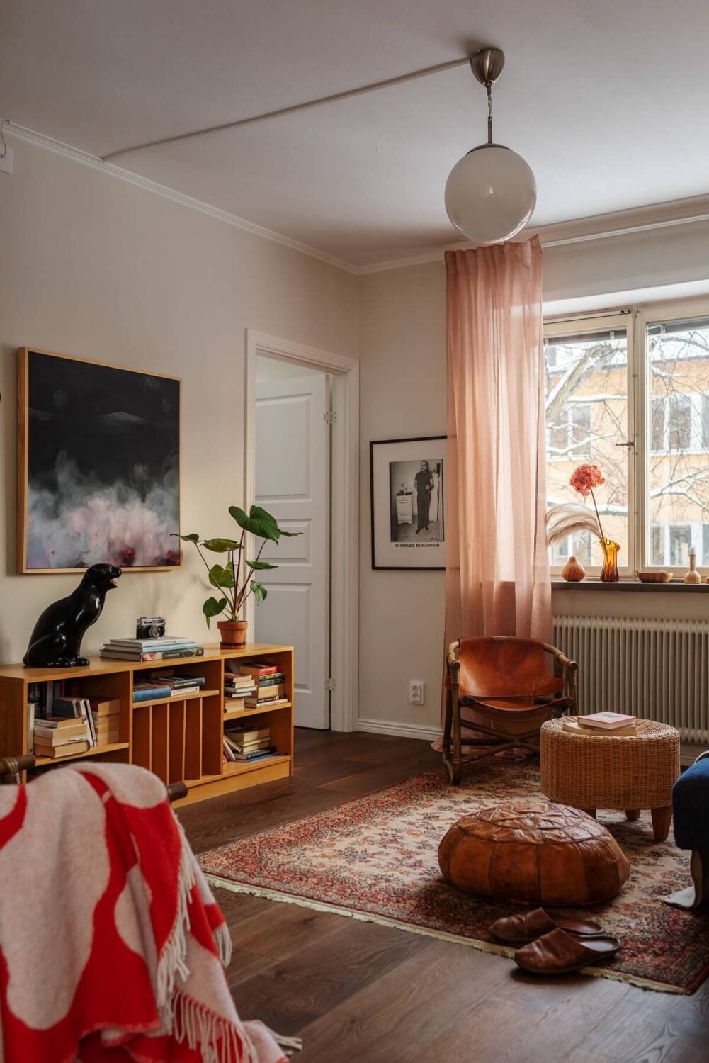 A Small Swedish Apartment with Warm Color Accents 6 small living room with dark wooden floor