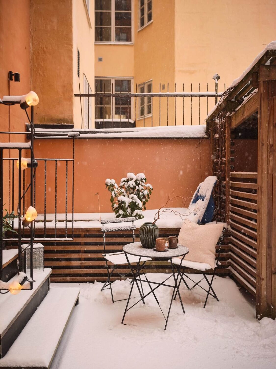 Serene Light Painted Spaces in a Swedish Apartment 21 snowy-courtyard-terrace