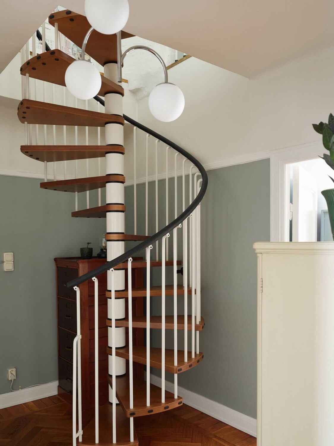 Green Tones in a Renovated Stockholm Duplex Apartment 12 spiral staircase