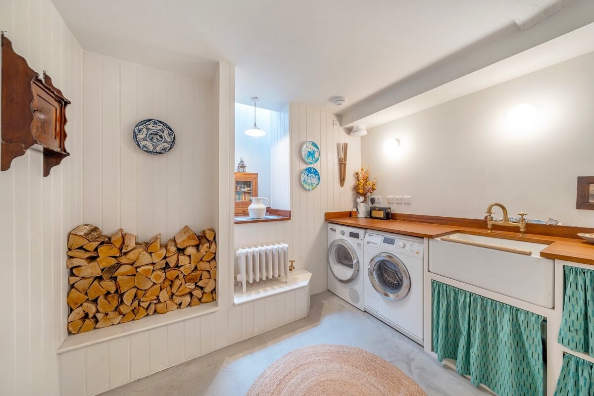 A Colorful Historic Family Home in London 15 utility room with green curtains