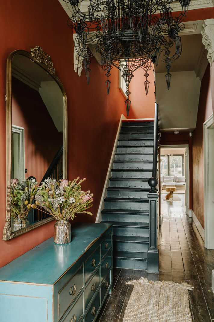 Colorful Walls in an English Victorian Townhouse 11 victorian hallway with wooden floor and red walls nordroom
