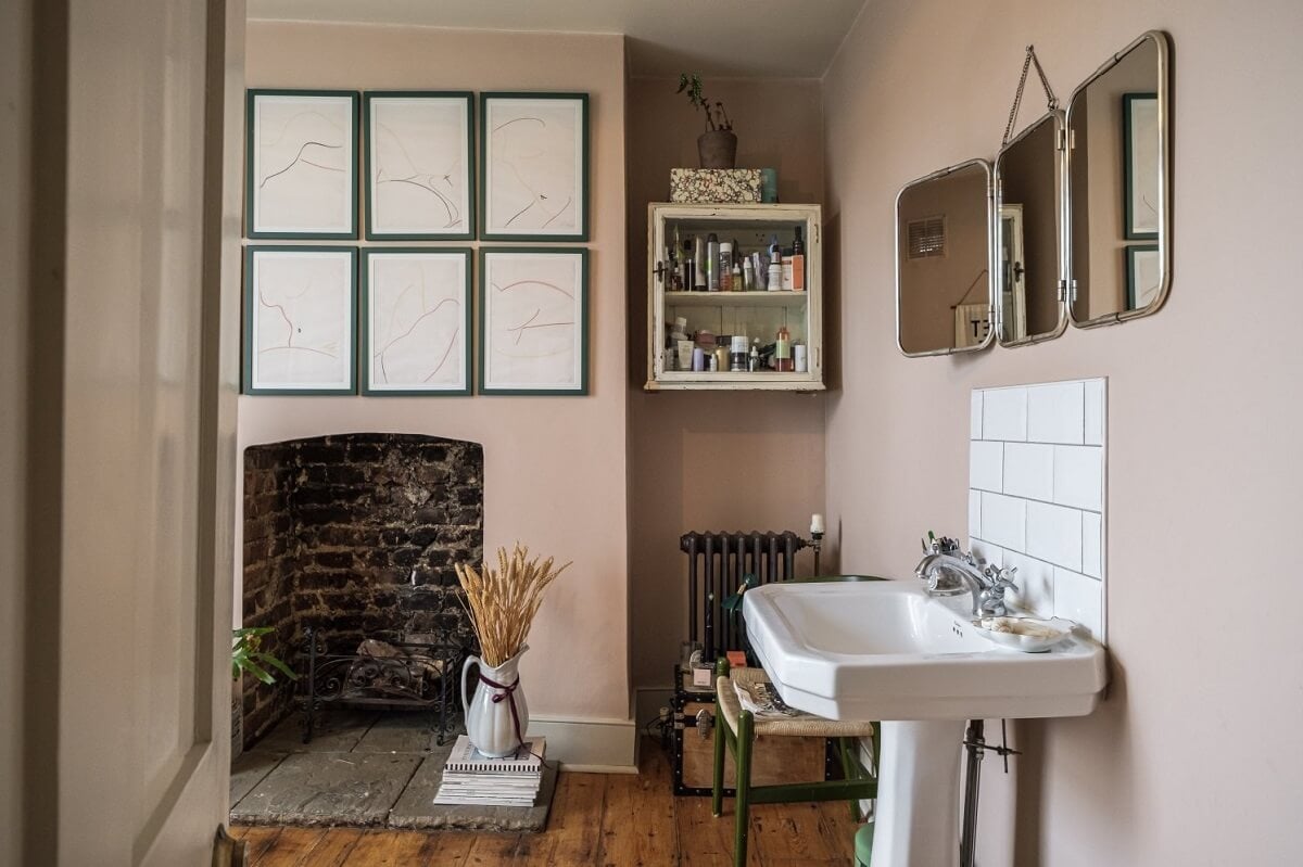 A Cozy and Charming Georgian Townhouse in London 24 vintage style bathroom with pink walls and brick fireplace