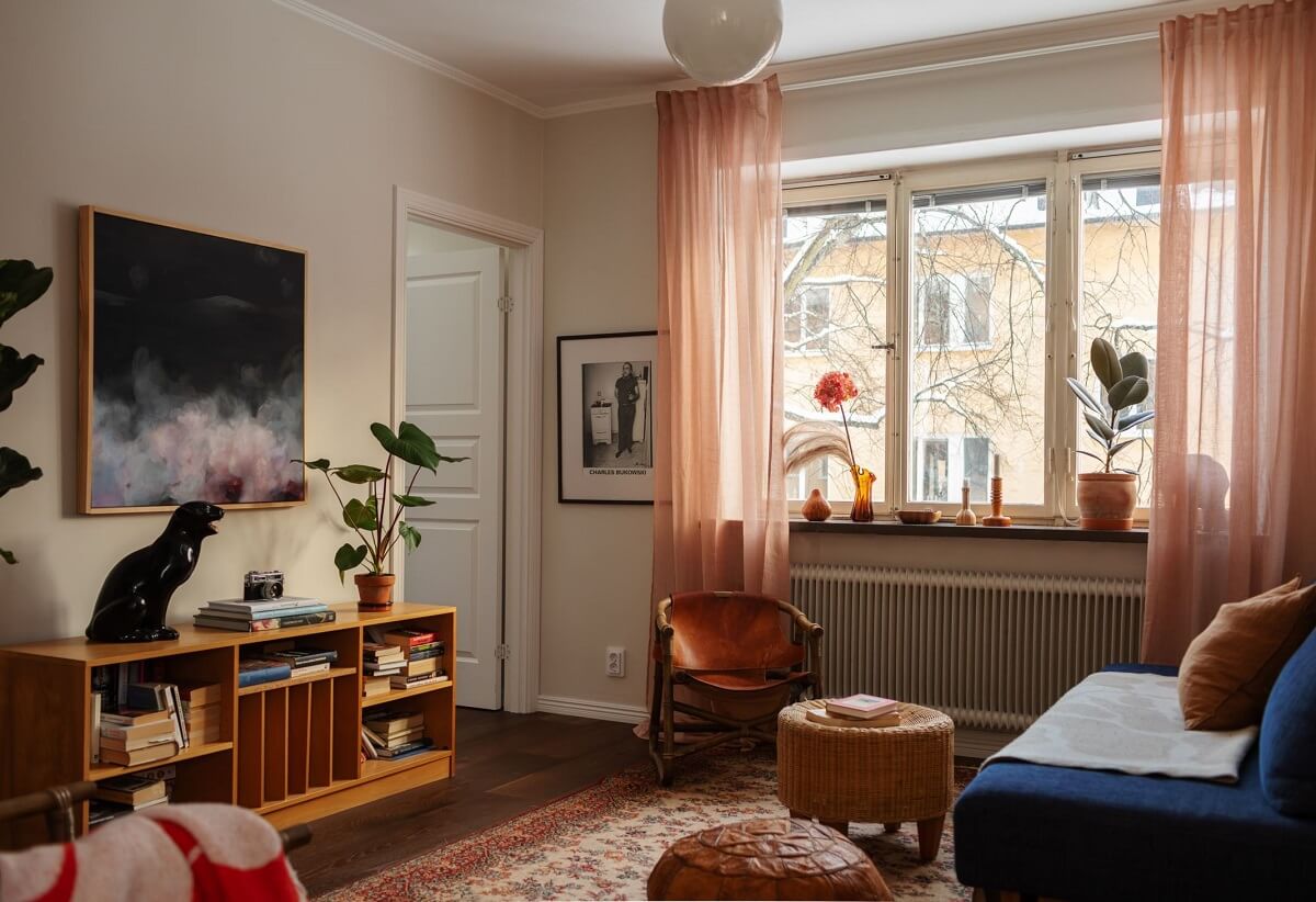 A Small Swedish Apartment with Warm Color Accents 3 warm color accents in small living room