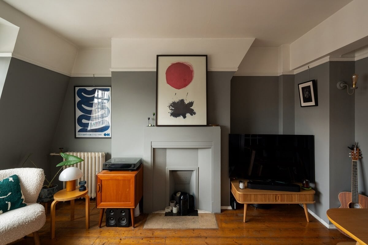 A Charming Top-Floor Apartment in an Art Deco Building 2 warm wooden floorboards in a gray living room