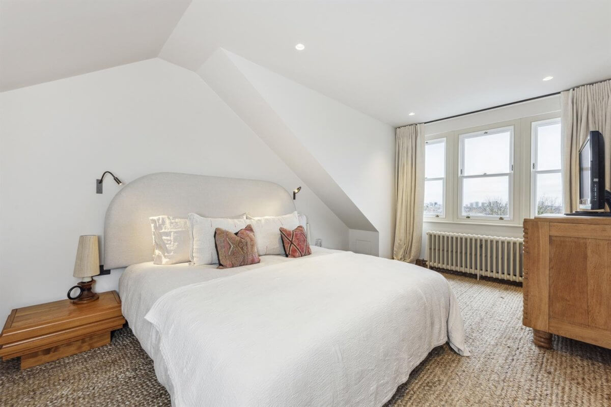 Modern Rustic Interiors in an Edwardian House in London 29 white bedroom with slanted ceiling