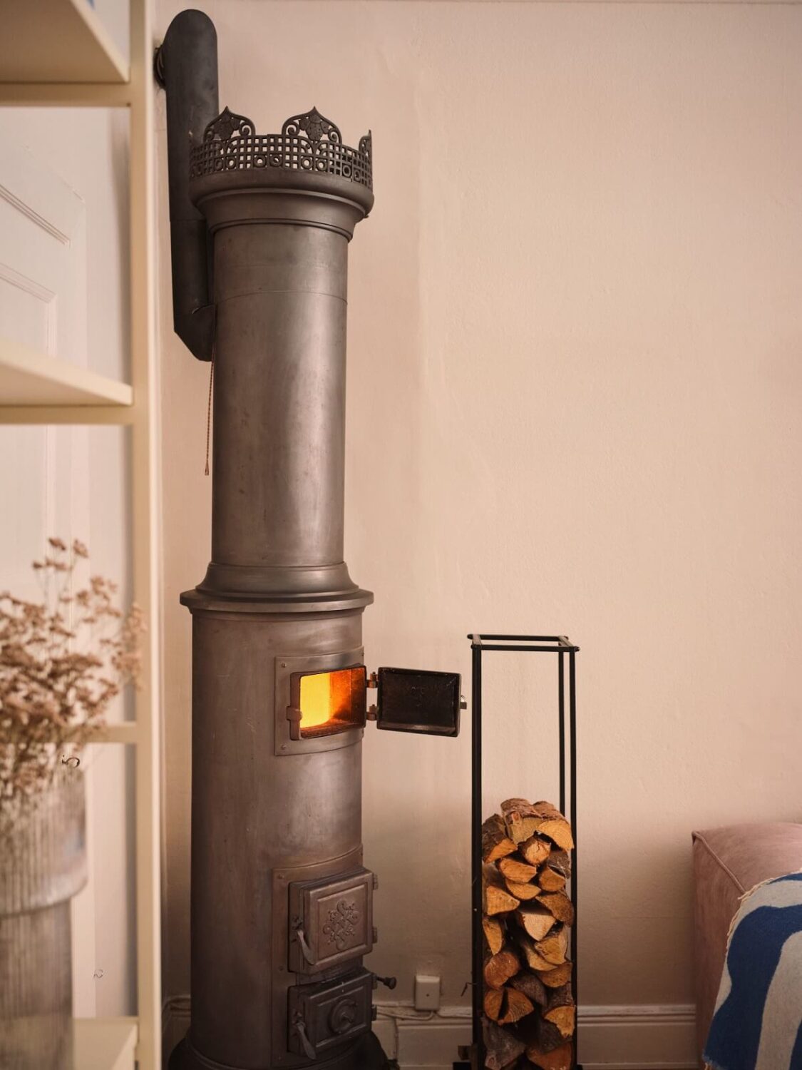 Serene Light Painted Spaces in a Swedish Apartment 5 woodburner-detail