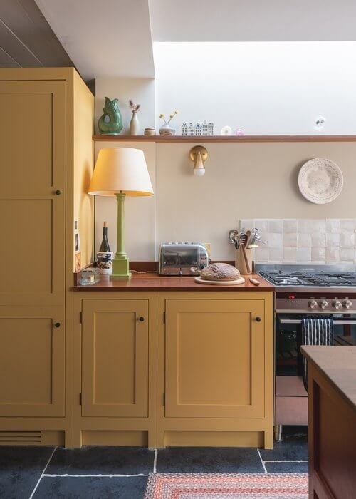 A Colorful Historic Family Home in London 12 yellow kitchen cabinets
