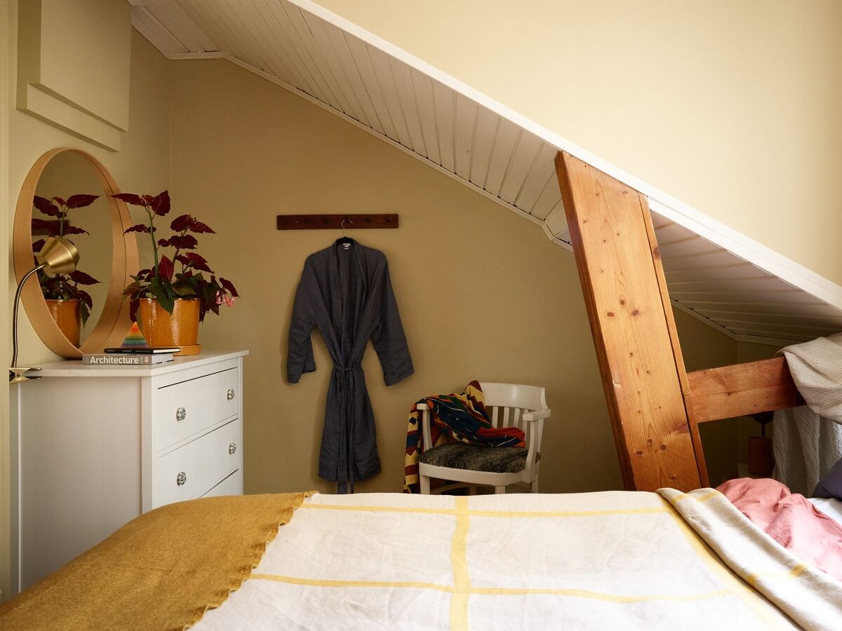 A Small Attic Apartment with a Golden Yellow Bedroom 15 attic bedroom with gold yellow walls