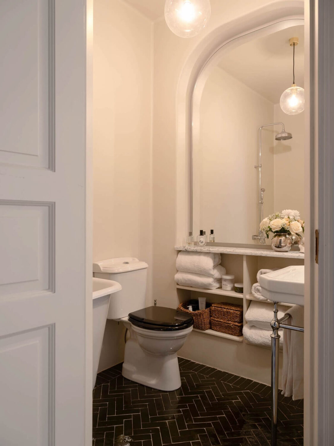 Best of 2024: Bathrooms 12 bathroom with black floor tiles and large mirror