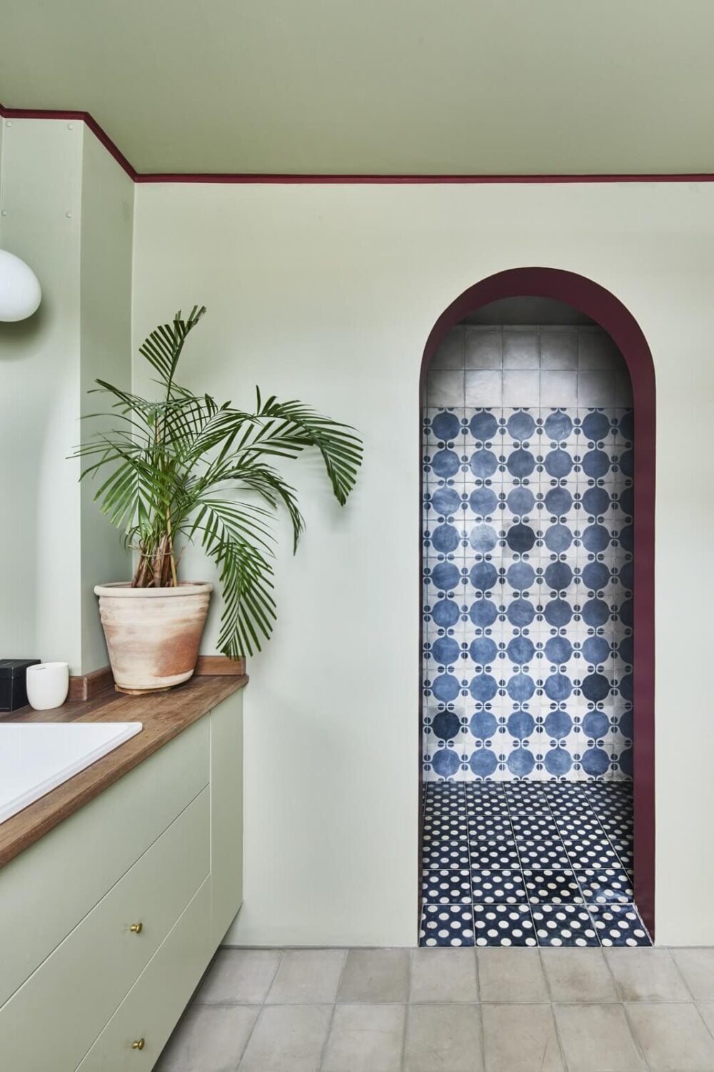 Inviting Colors in a Charming Georgian House in London 16 bathroom with dark pink color accent arched shower entrance