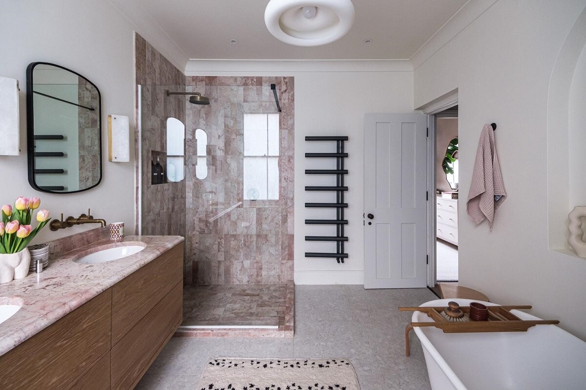 A London House Decorated in Gray and Beige Tones 19 bathroom with double sinks walk in shower and freestanding bath