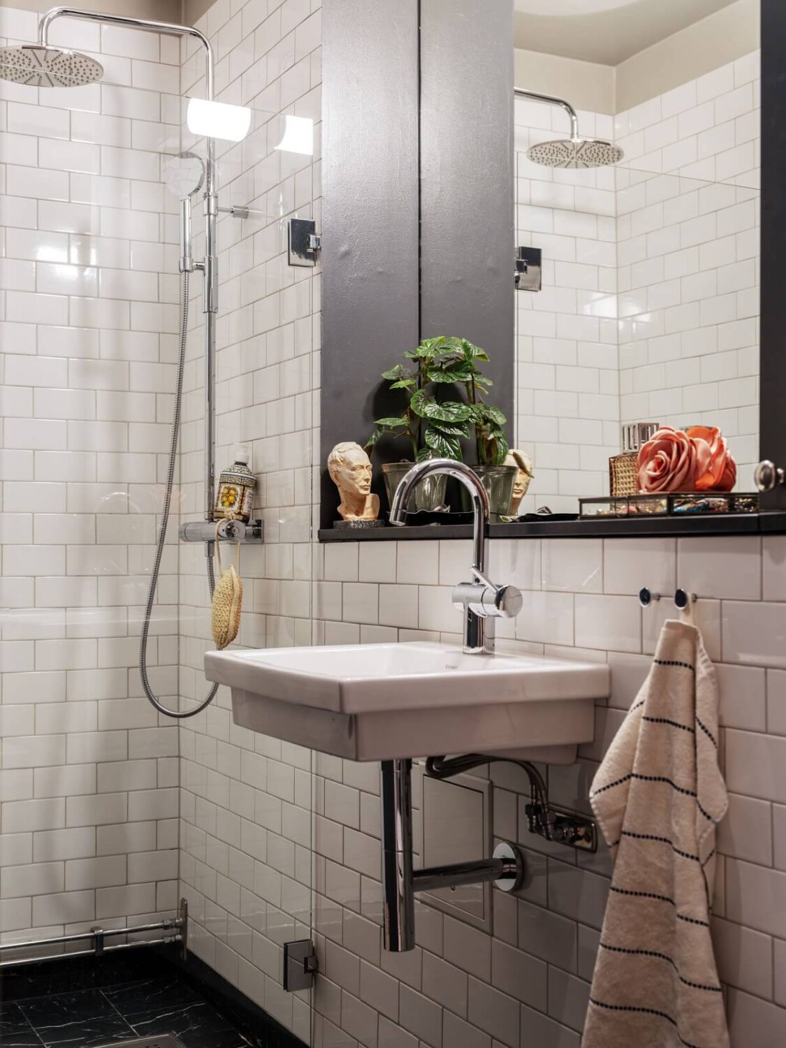 A Muted Color Palette in a Scandinavian Apartment 18 bathroom with white subway tiles