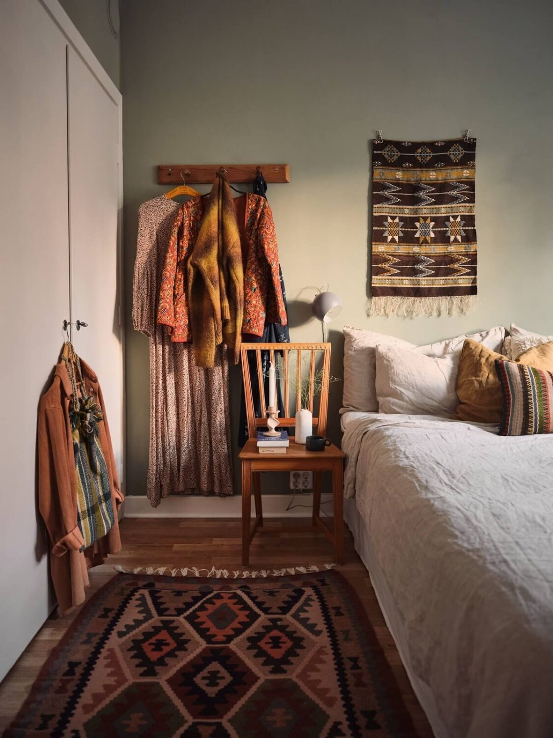 A Small Apartment with a Cozy Dining Nook 14 bedroom with earth colored textiles