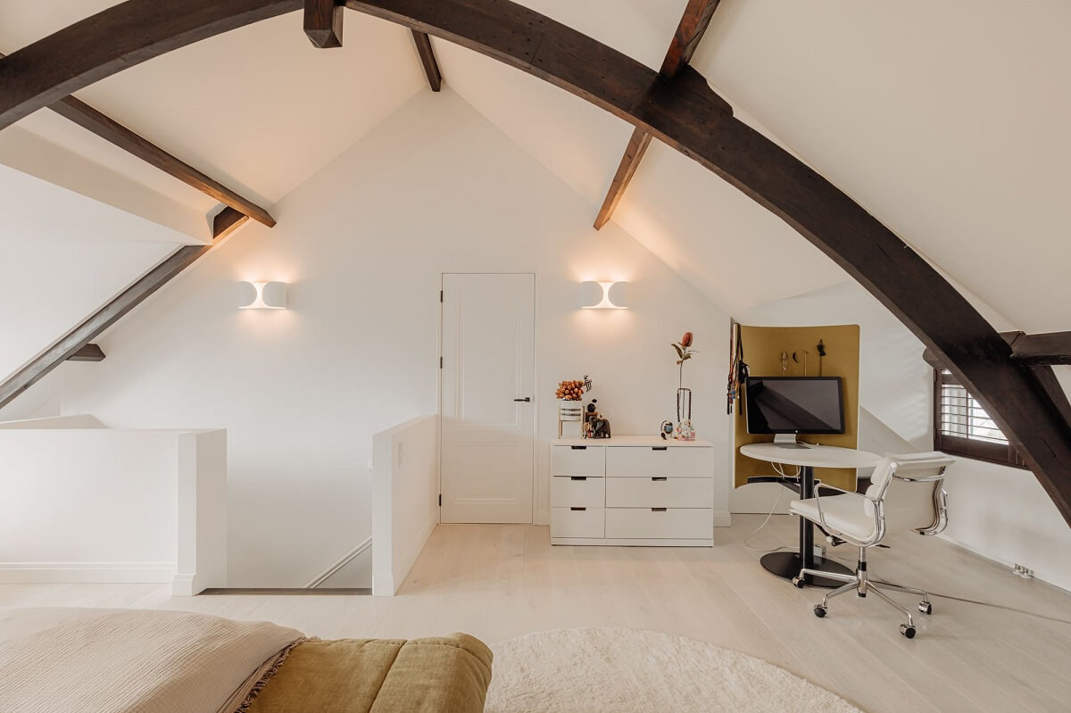 A Beautifully Renovated Dike House in The Netherlands 21 bedroom with exposed beams and small home office