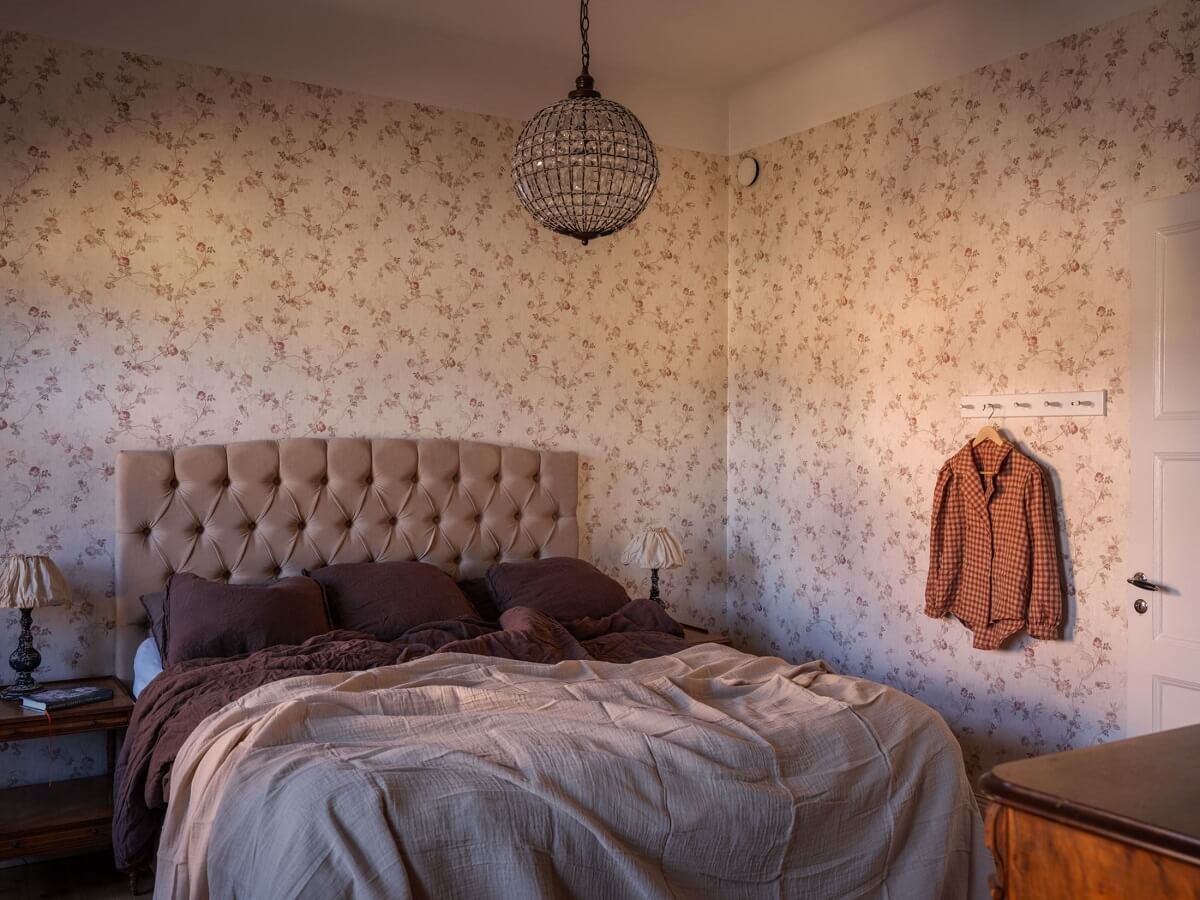 A Classic Swedish Apartment Decorated in Green and Pink Tones 20 bedroom with rose patterned wallpaper