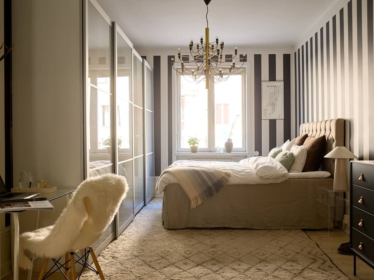 A Social Scandinavian Apartment with a Light Blue Living Room 13 bedroom with striped wallpaper wardrobes and home office