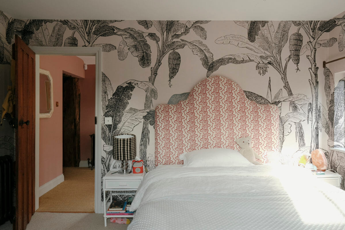 A Barn House with Vintage Decor and Exposed Beams 36 bedroom with wallpaper