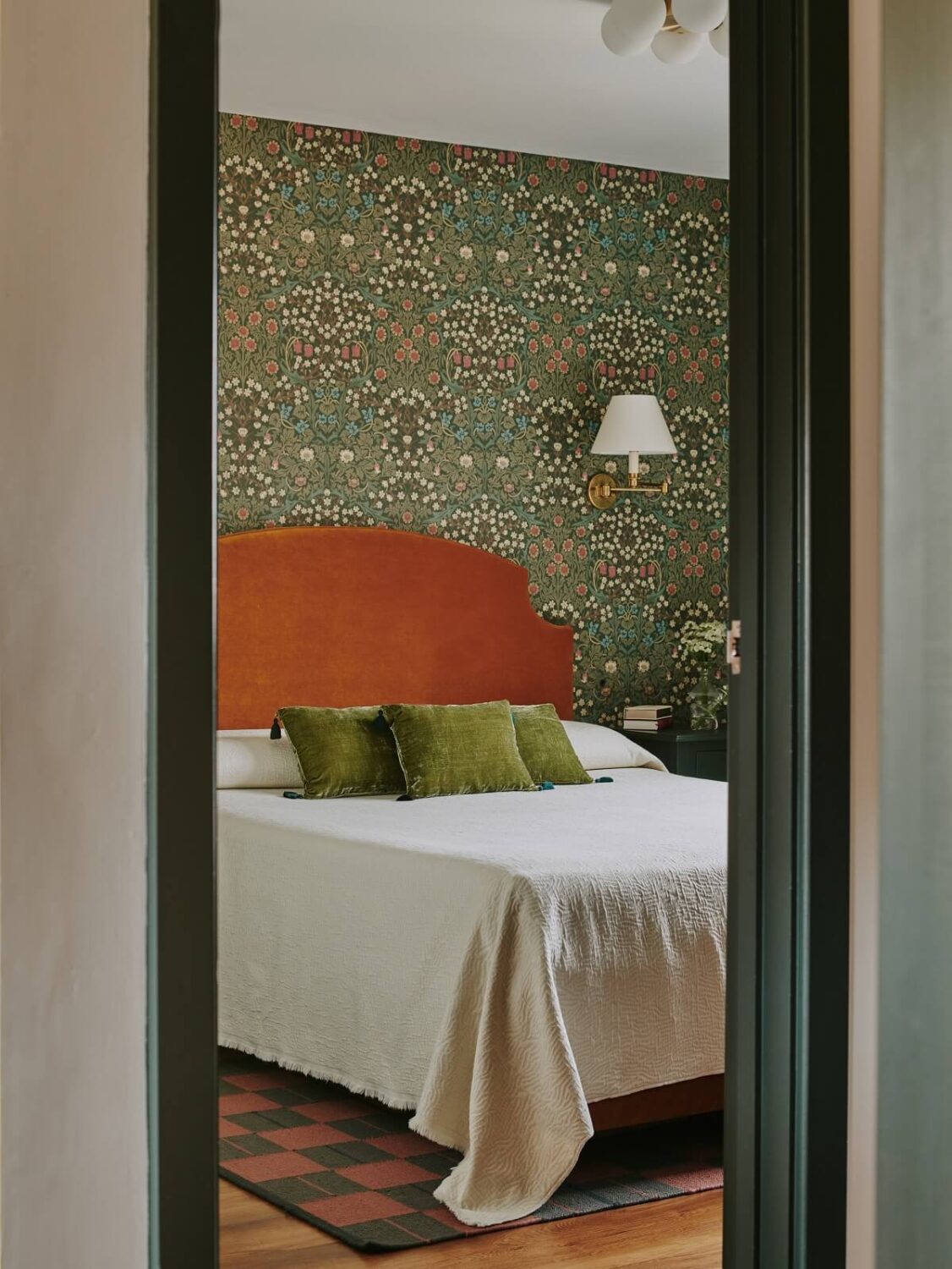 Persian and British Influences in a Cotswolds Family Home 12 bedroom-with-william-morris-wallpaper-and-rich-ochre-velvet-headboard-nordroom
