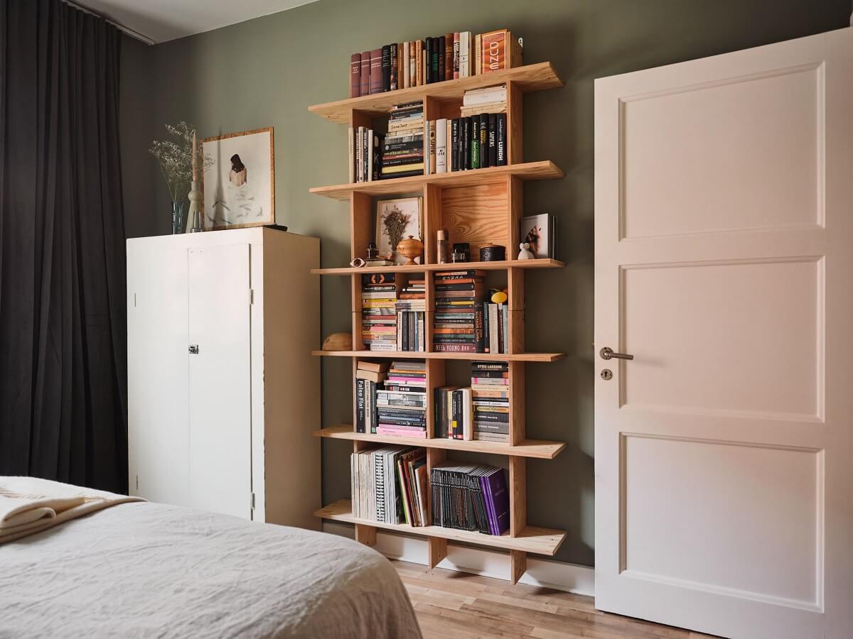 A Small Apartment with a Cozy Dining Nook 15 bedroom with wooden bookcase