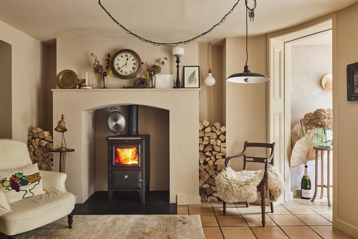 Inviting Colors in a Charming Georgian House in London 7 beige sitting room with fireplace and stone floor