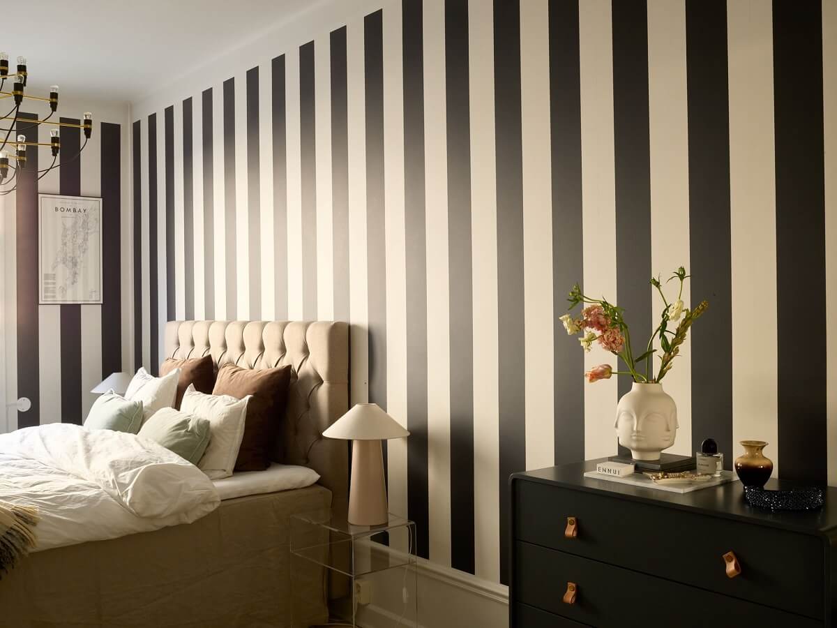A Social Scandinavian Apartment with a Light Blue Living Room 14 black and white striped wallpaper in master bedroom