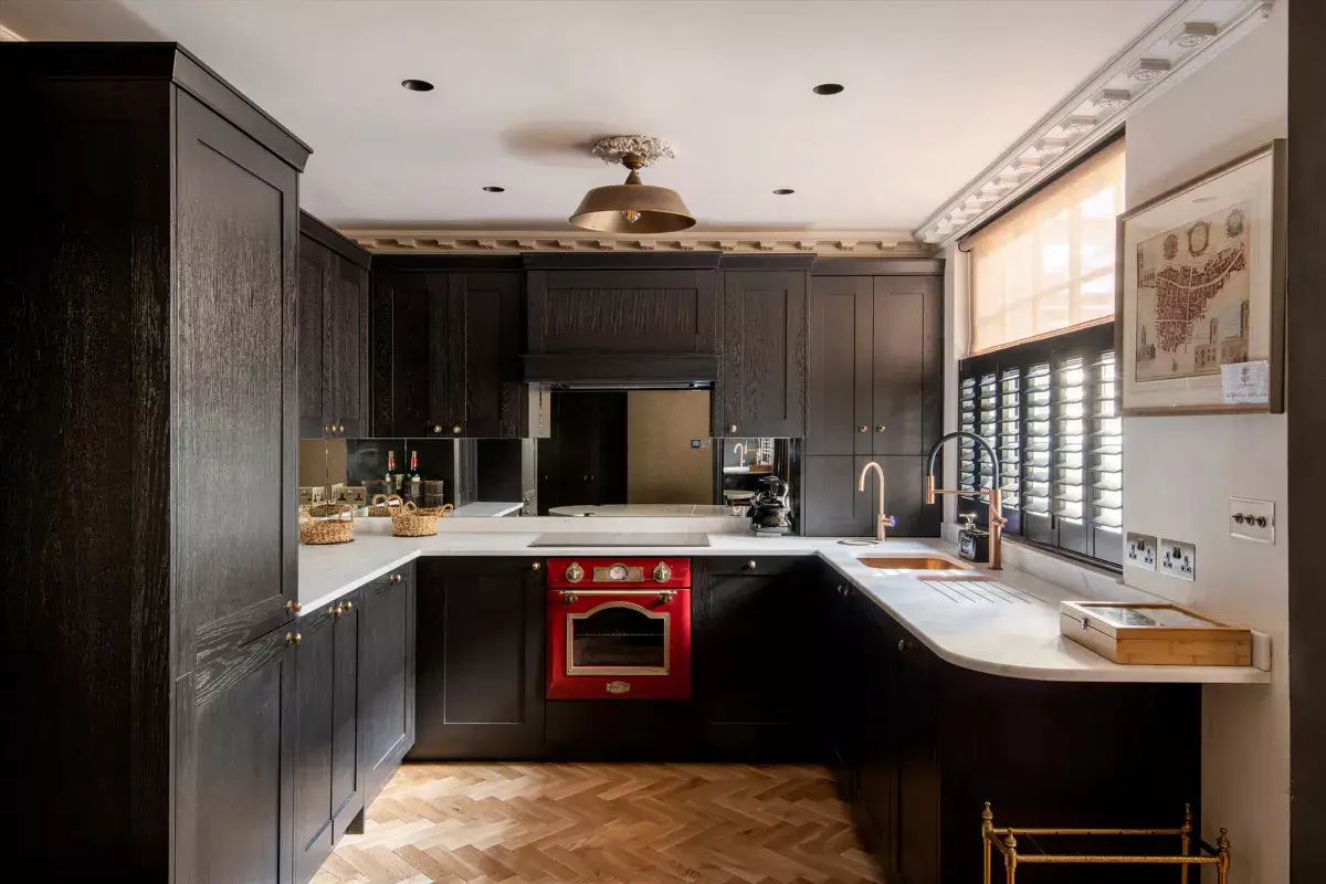A Stylish Renovated House in Notting Hill 4 black kitchen with red oven