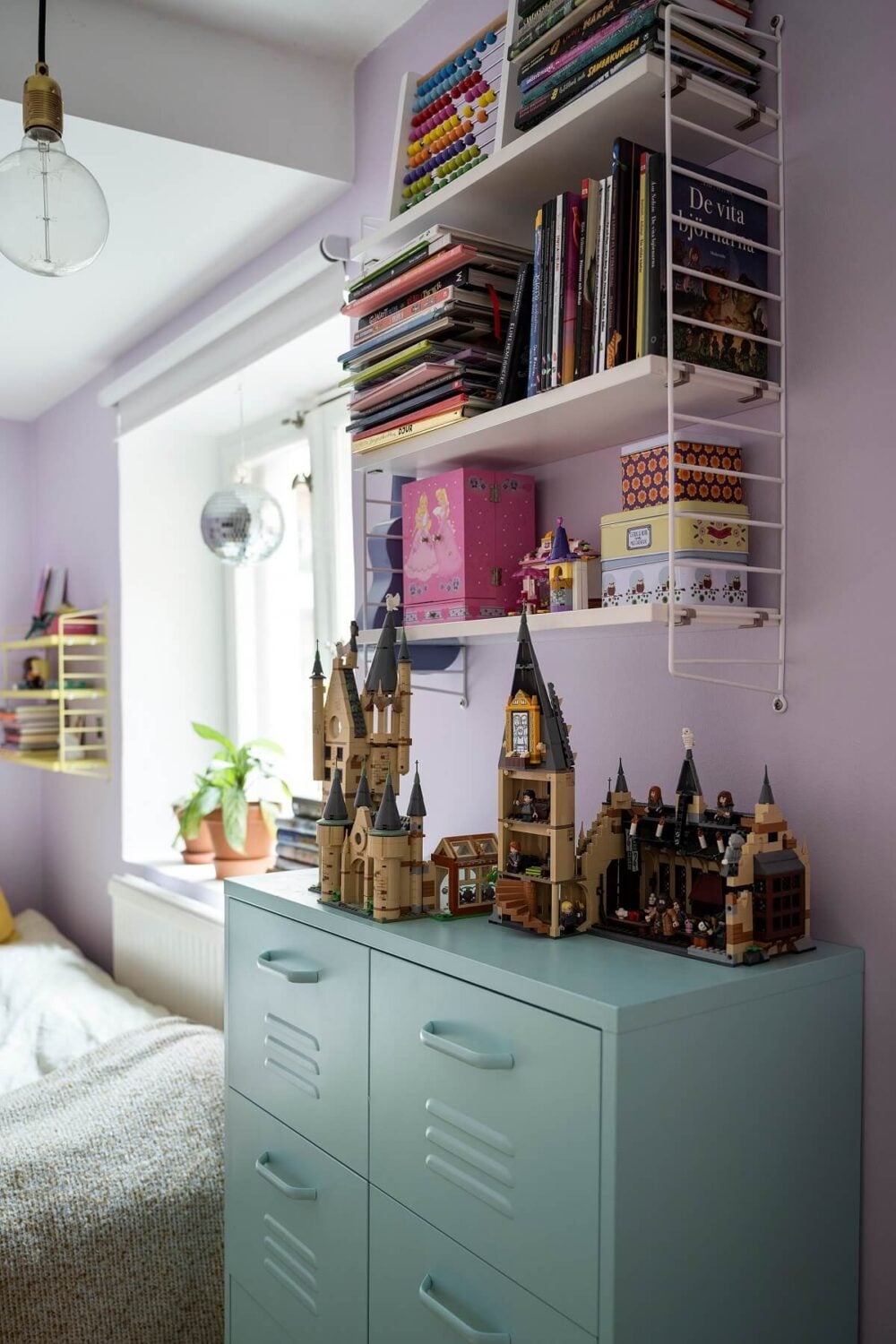 A Basement Family Apartment with Colorful Furniture and Decor 19 bookshelves and pale blue cabinet