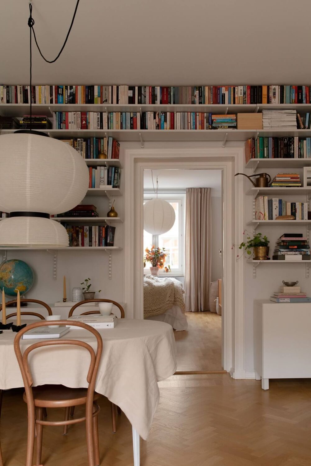 A Light Colored Swedish Apartment 7 bookshelves in living room