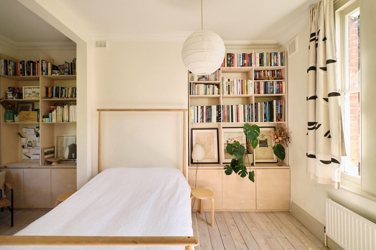A Light London Apartment with a Yellow Kitchen 13 built in bookcases in bedroom with ikea bed