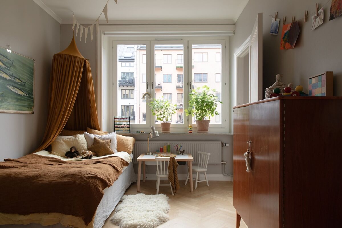 A Light Colored Swedish Apartment 16 children bedroom with earthy bedding