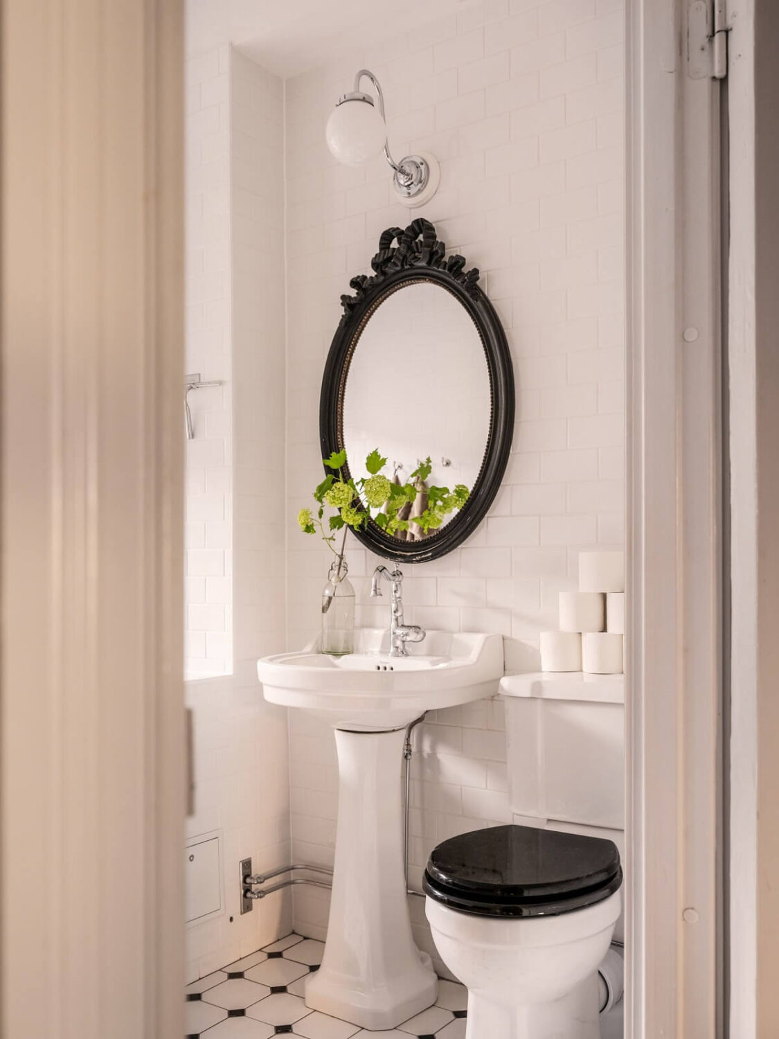 A Classic Swedish Apartment Decorated in Green and Pink Tones 25 classic black and white bathroom