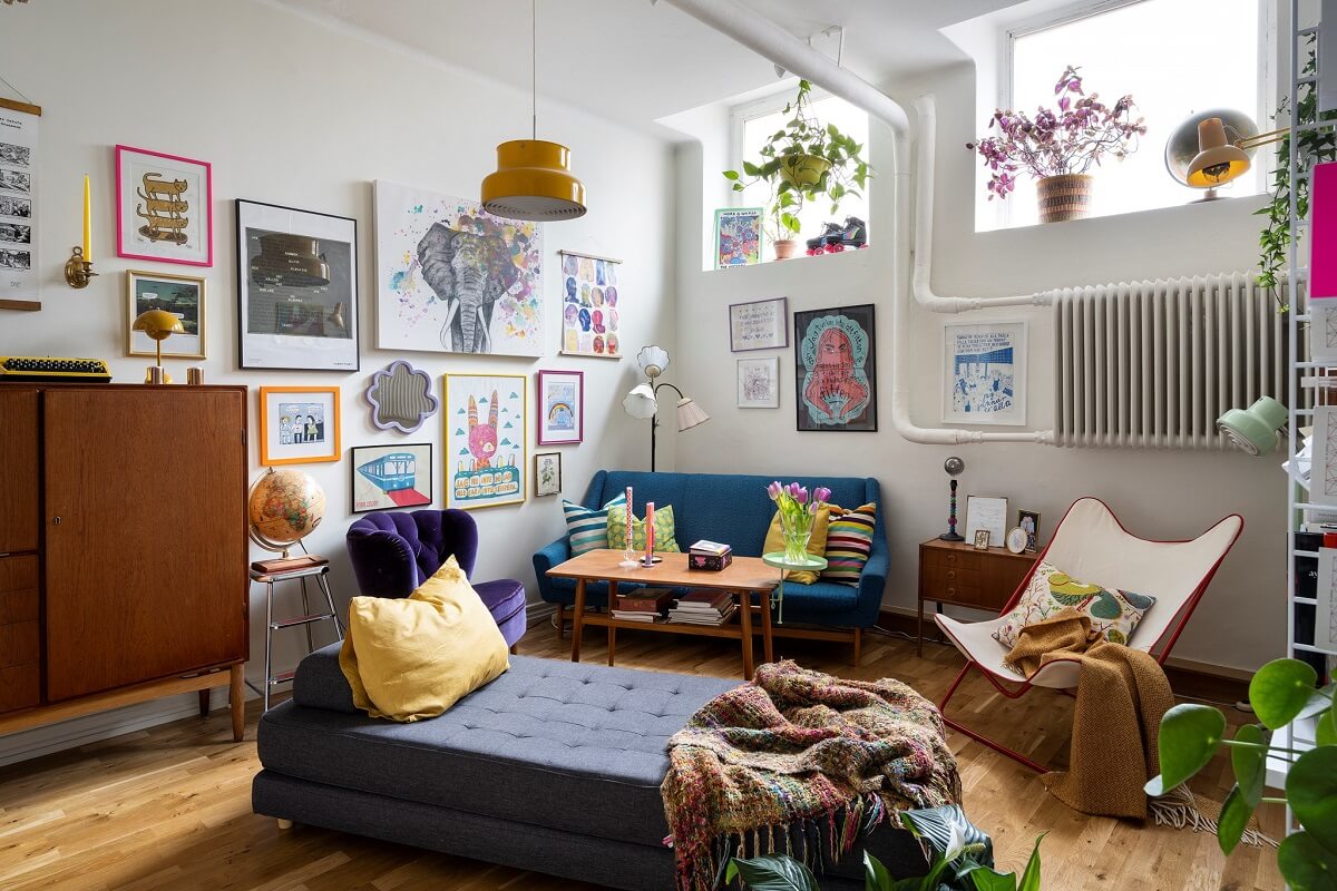 colorful furniture in loft style living room with high window