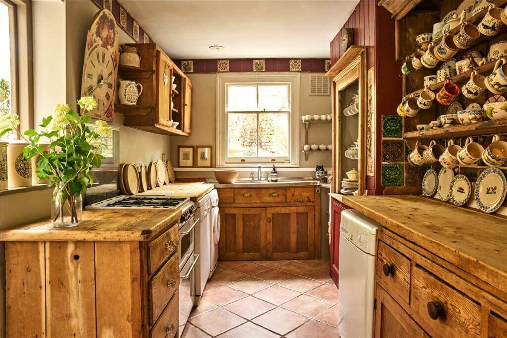 A Warm Muted Color Palette in a Victorian House 13 cottage style wooden kitchen with stone floor