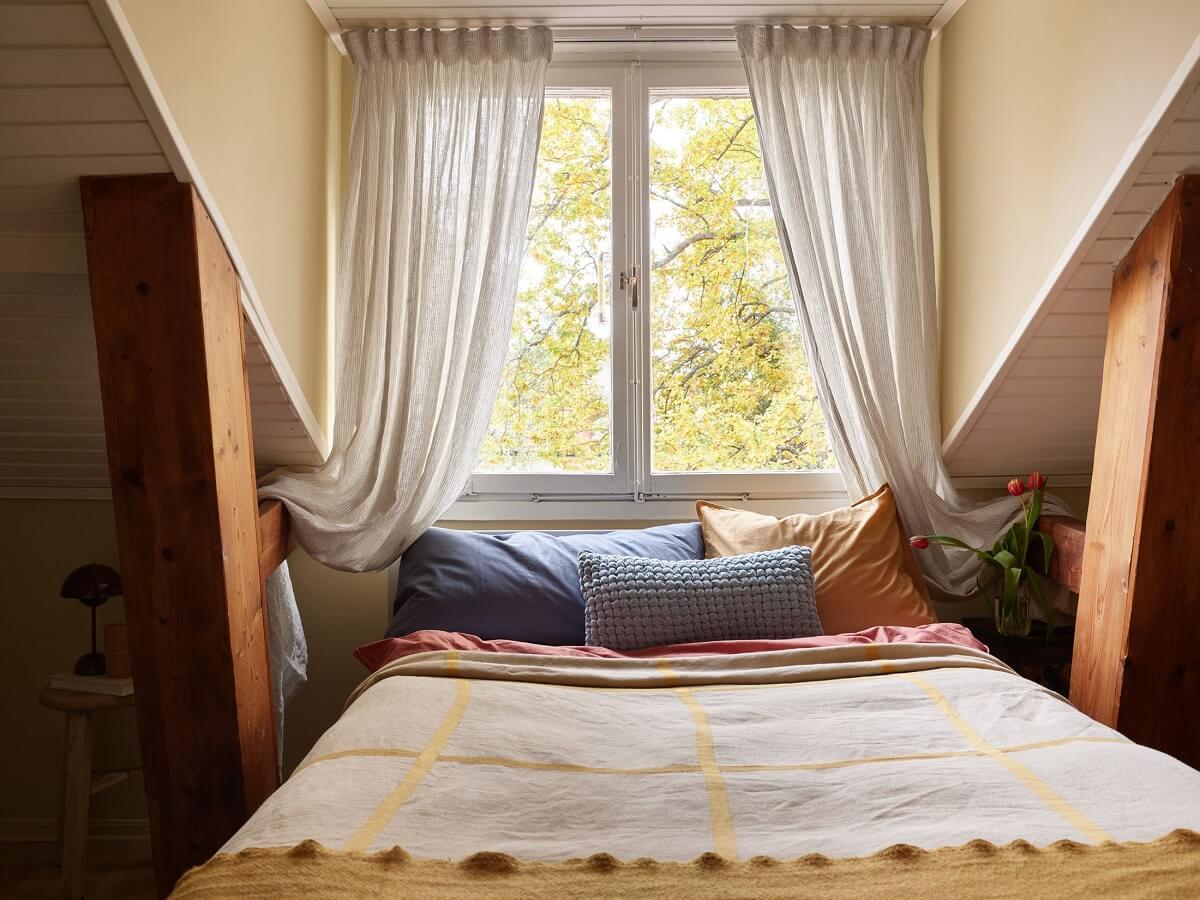 A Small Attic Apartment with a Golden Yellow Bedroom 14 cozy attic bedroom
