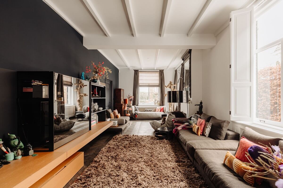 A Beautifully Renovated Dike House in The Netherlands 7 cozy television room with large rug