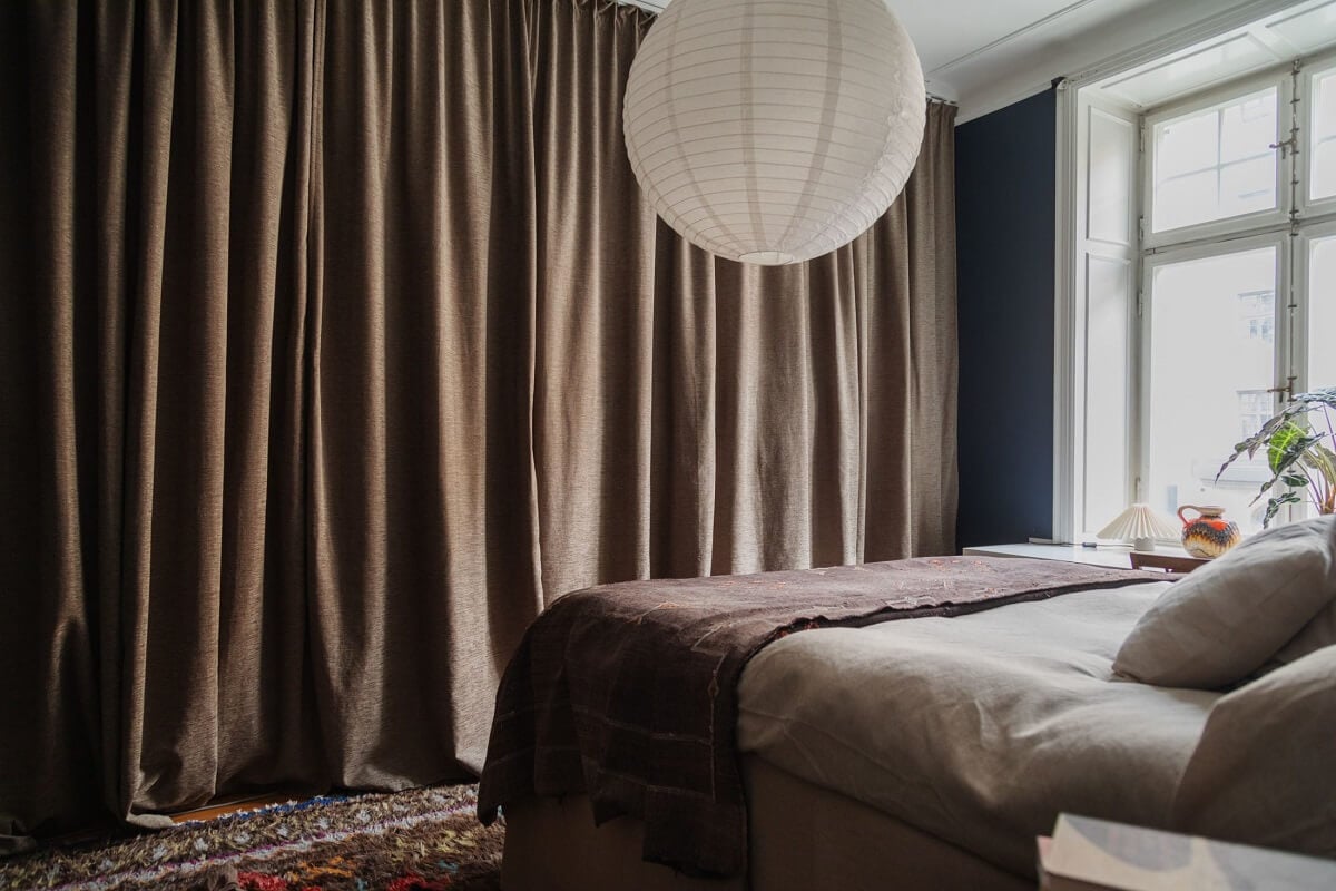 Moody Rooms in a Grand Stockholm Apartment 18 dark blue bedroom with wardrobes behind curtain