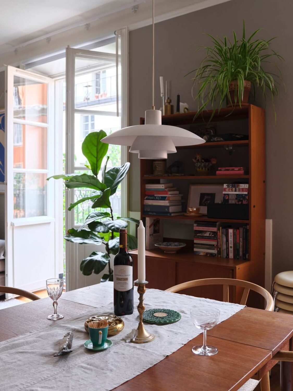 A Small Gray Apartment with Industrial Glass Walls 10 design pendant and dining table
