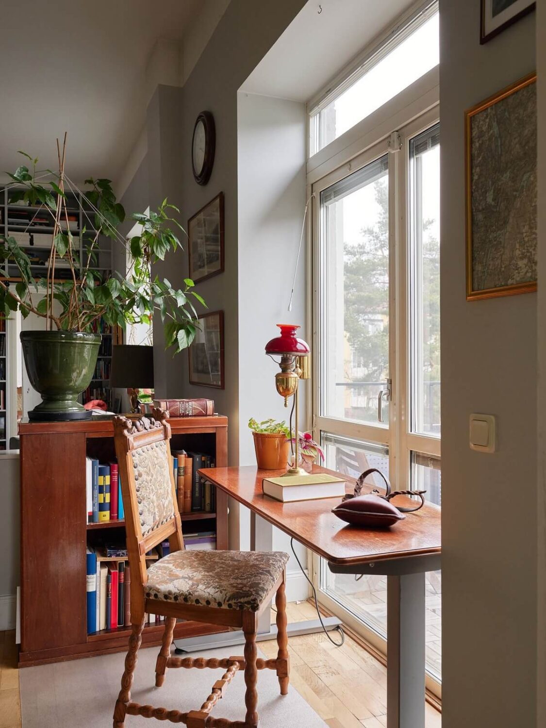 Floor-to-Ceiling Bookcases in a 1950s Swedish Home 8 desk in front of window