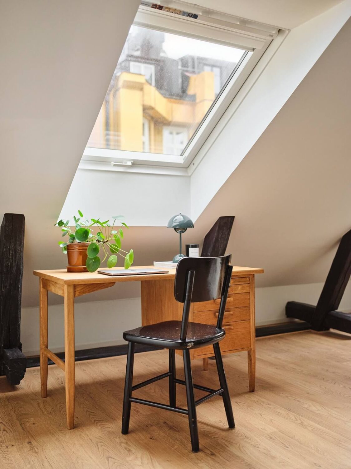 A Light Filled Duplex Apartment in Sweden 19 desk under skylight
