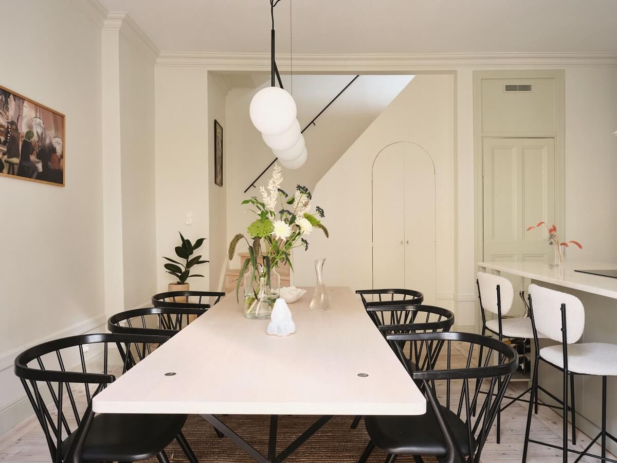 A Light Filled Duplex Apartment in Sweden 9 dining table with black chairs