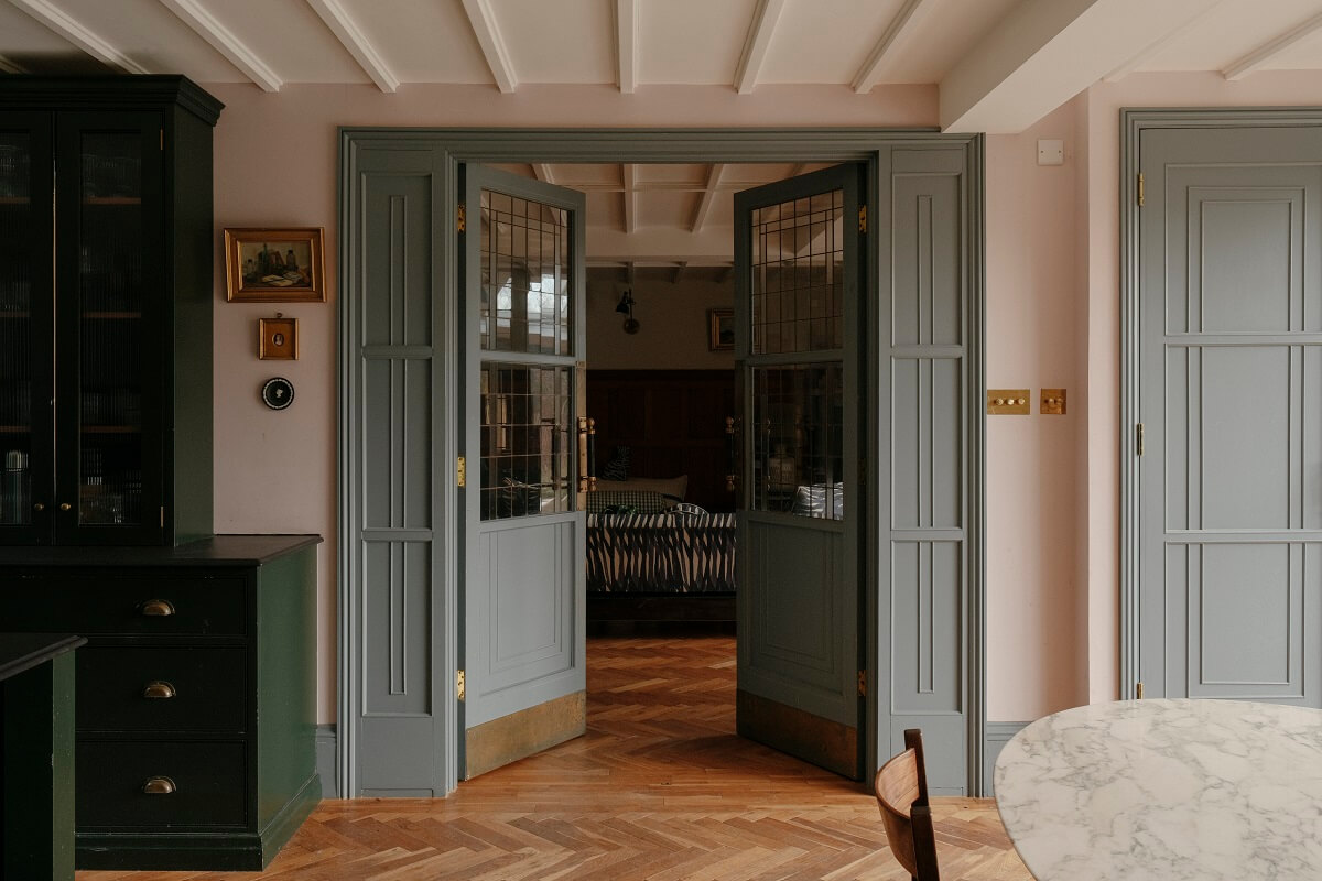 A Barn House with Vintage Decor and Exposed Beams 16 double wooden doors