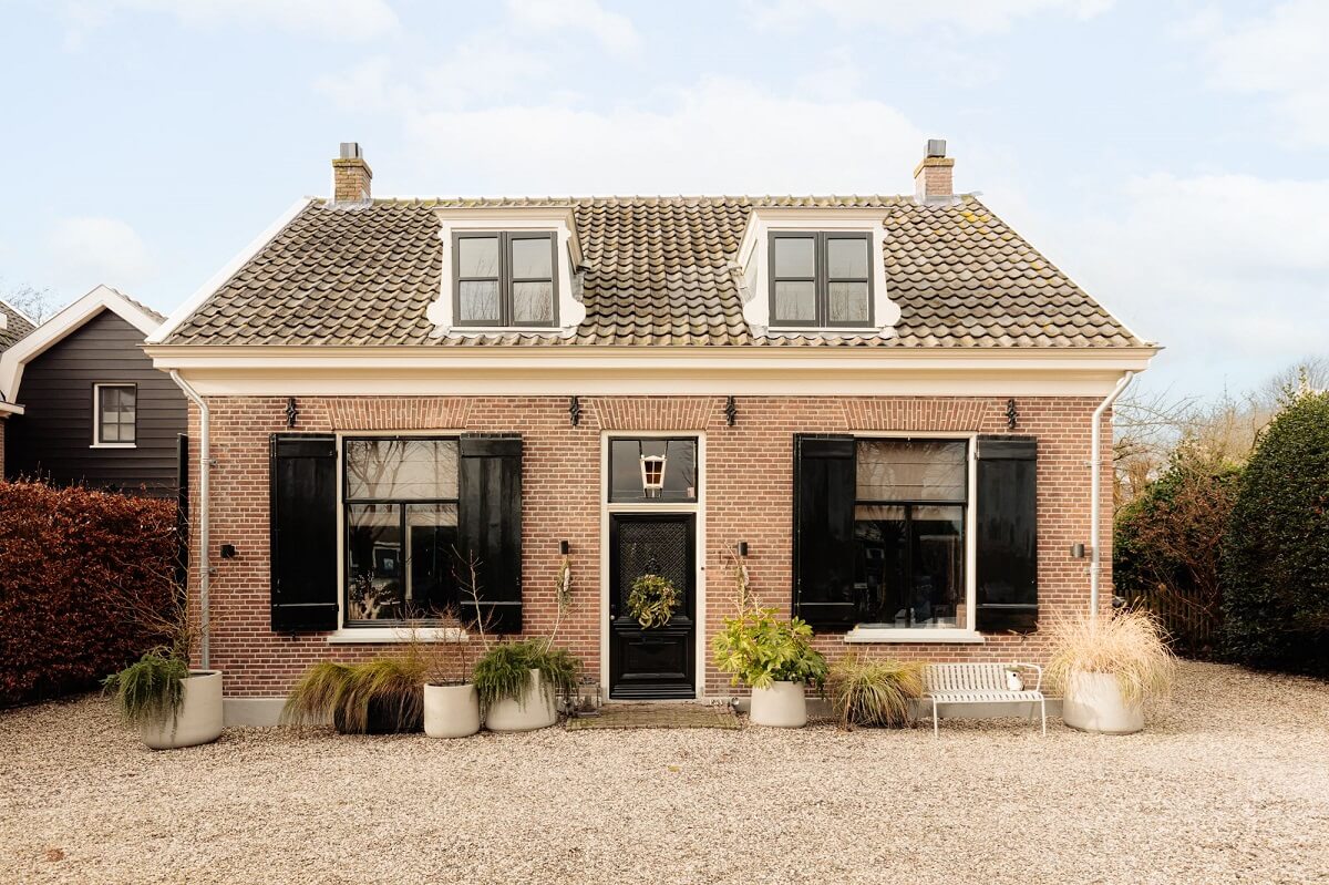 A Beautifully Renovated Dike House in The Netherlands 27 dutch house with black shutters