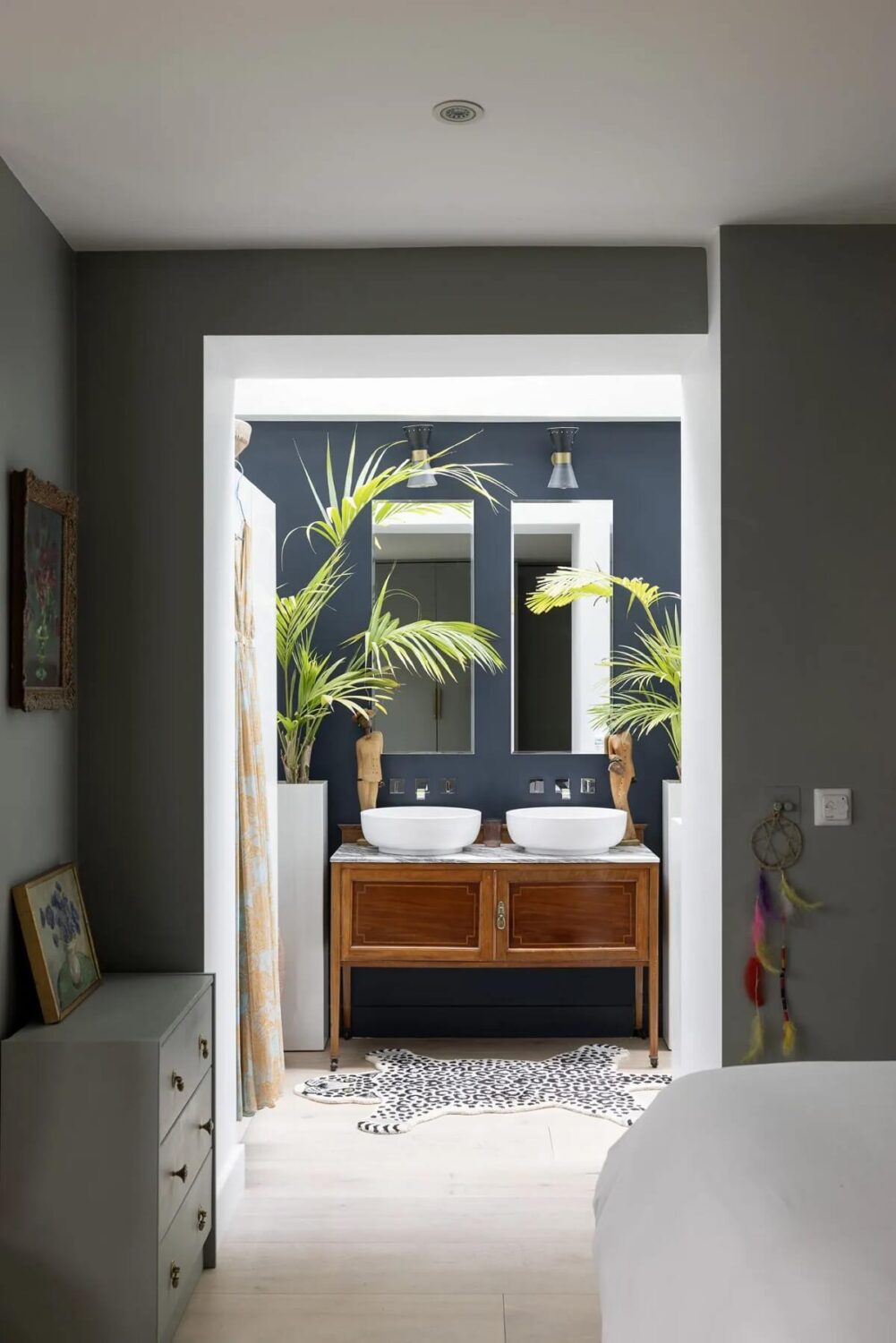 A Modern Apartment with Skylights in a Historic Building 13 en suite bathroom with double basin and dark gray wall