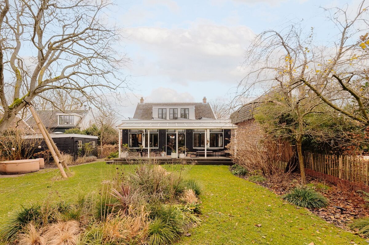 A Beautifully Renovated Dike House in The Netherlands 26 garden and veranda dutch house