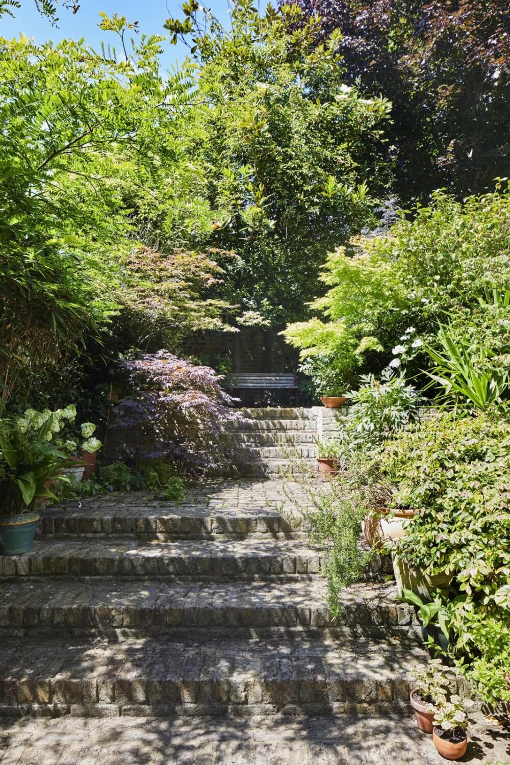 Inviting Colors in a Charming Georgian House in London 23 garden stairs